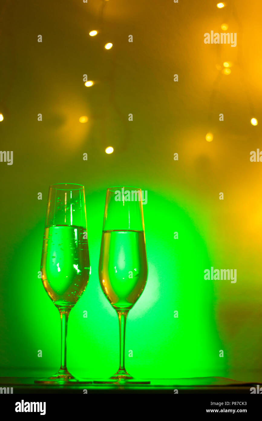 Champagne sparkling wine glass of prosecco cava in discotque party bar during wedding in Ibiza Spain with lights behind. Stock Photo