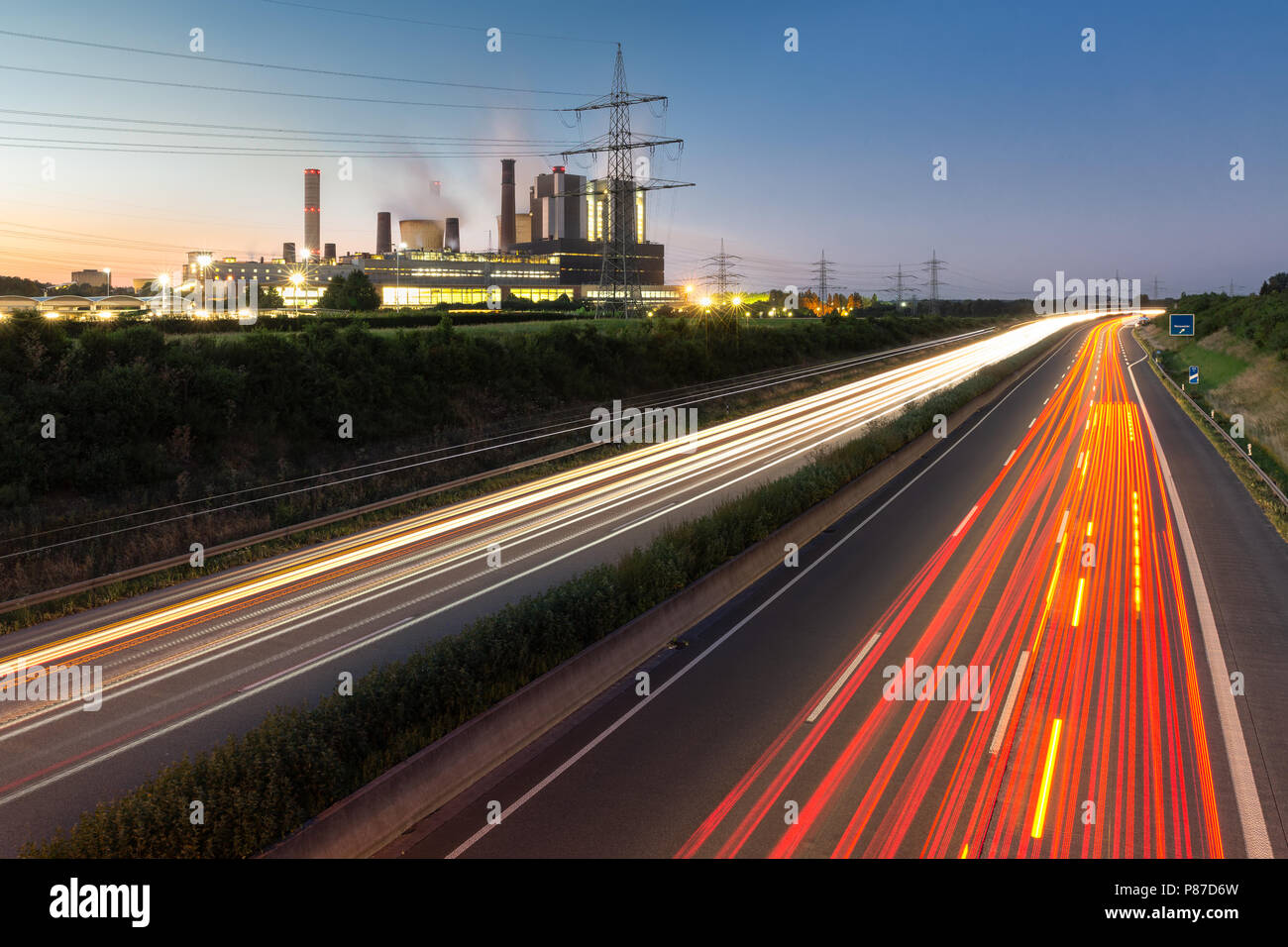 Long exposure sunset over German highway along power plant , Germany Stock Photo