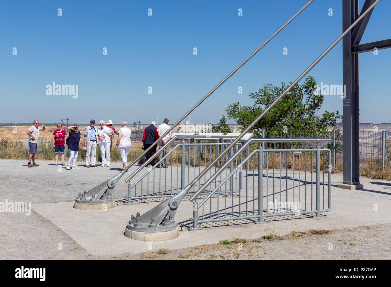 People visiting viewpoint with skywalk at Garzweiler brown-coal mine Germany Stock Photo