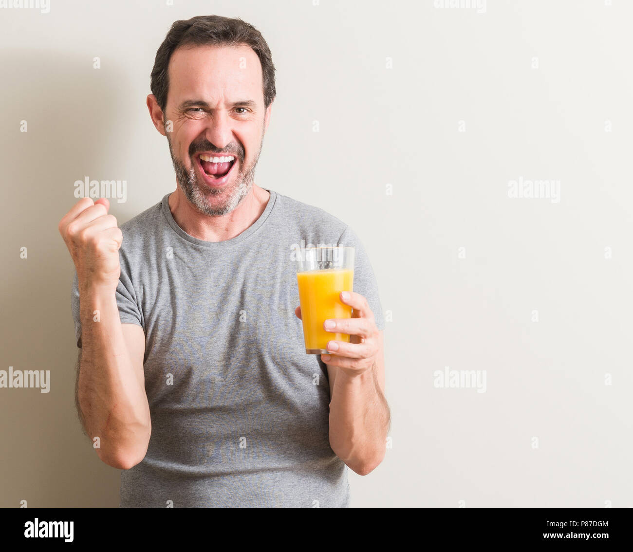 Senior Man Drinking Orange Juice High Resolution Stock Photography And Images Alamy