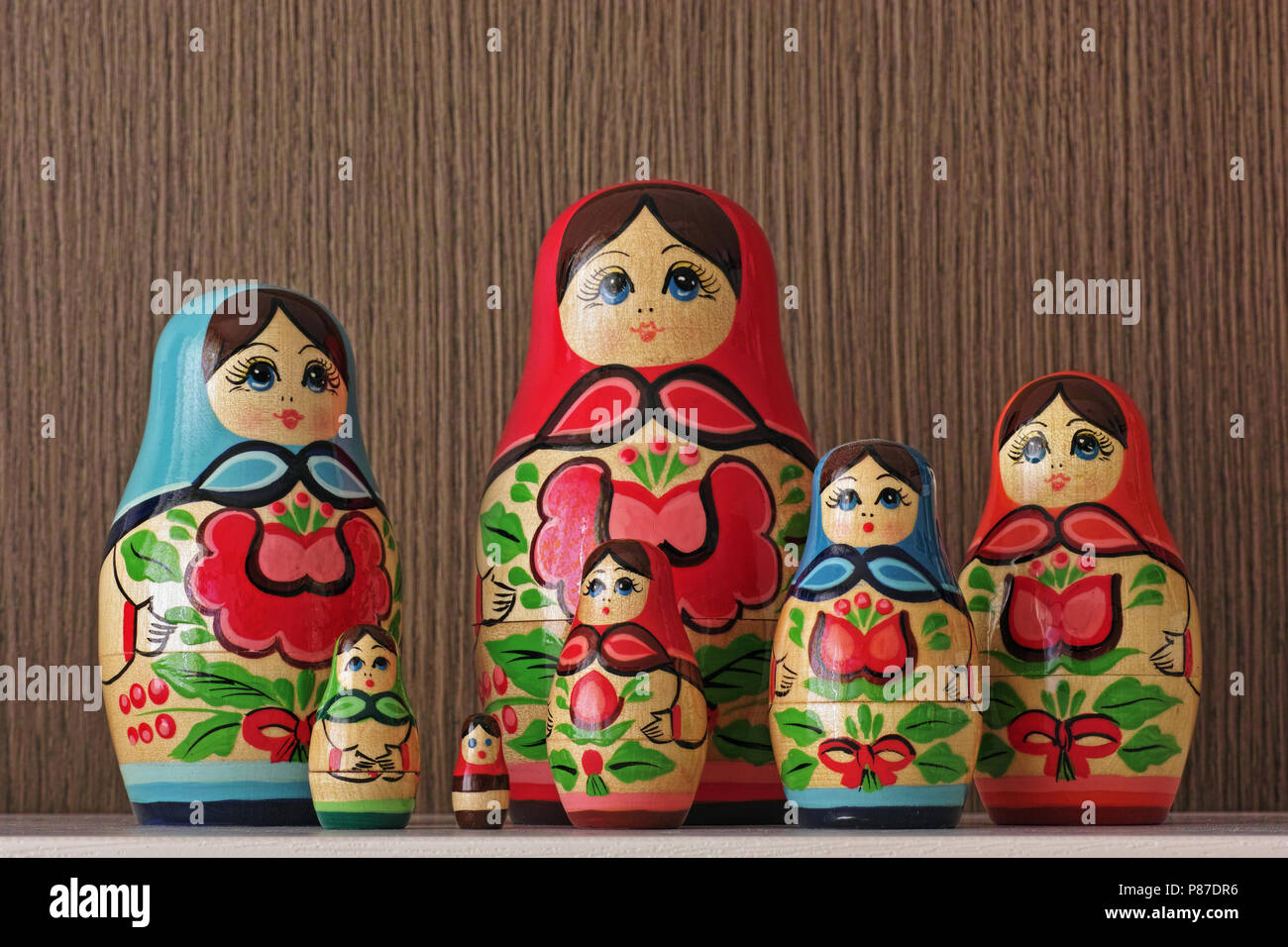 colorful matryoshka composed of seven female figures Stock Photo
