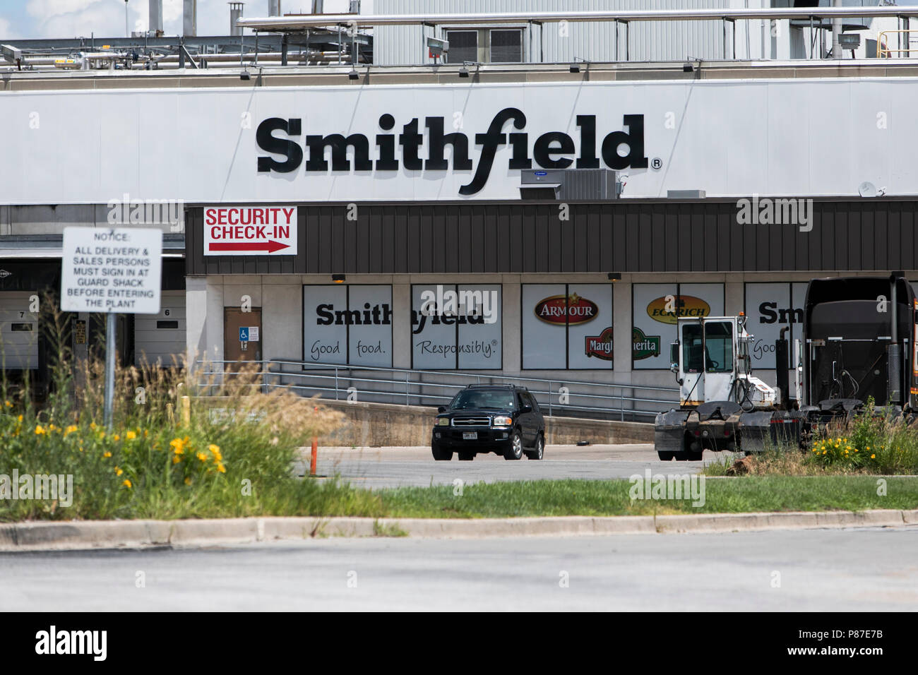 A logo sign outside of a facility occupied by Smithfield Foods, Inc