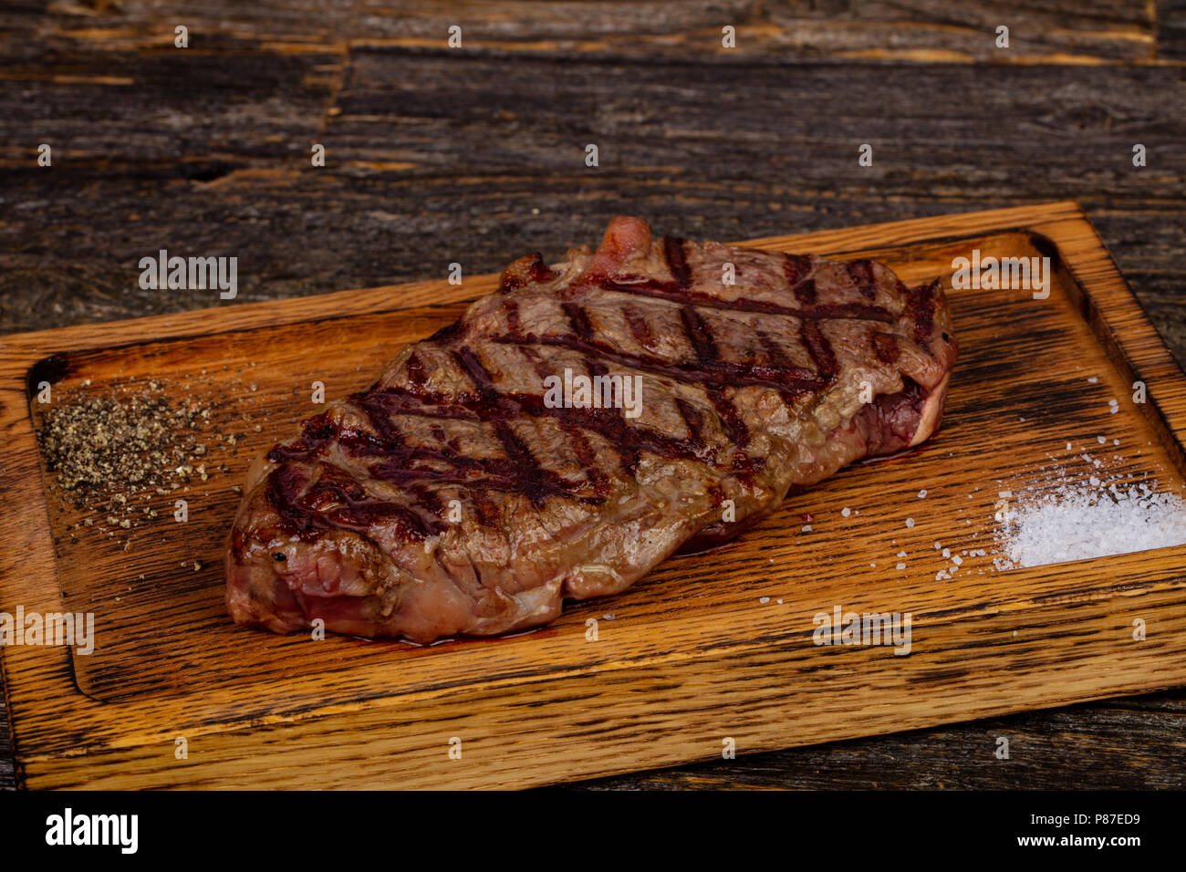 Grilled strip loin steak with salt and pepper Stock Photo Alamy