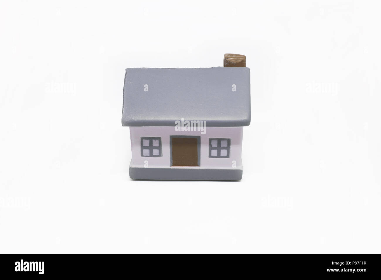 Miniature house with silver keys concept of a new home real estate and