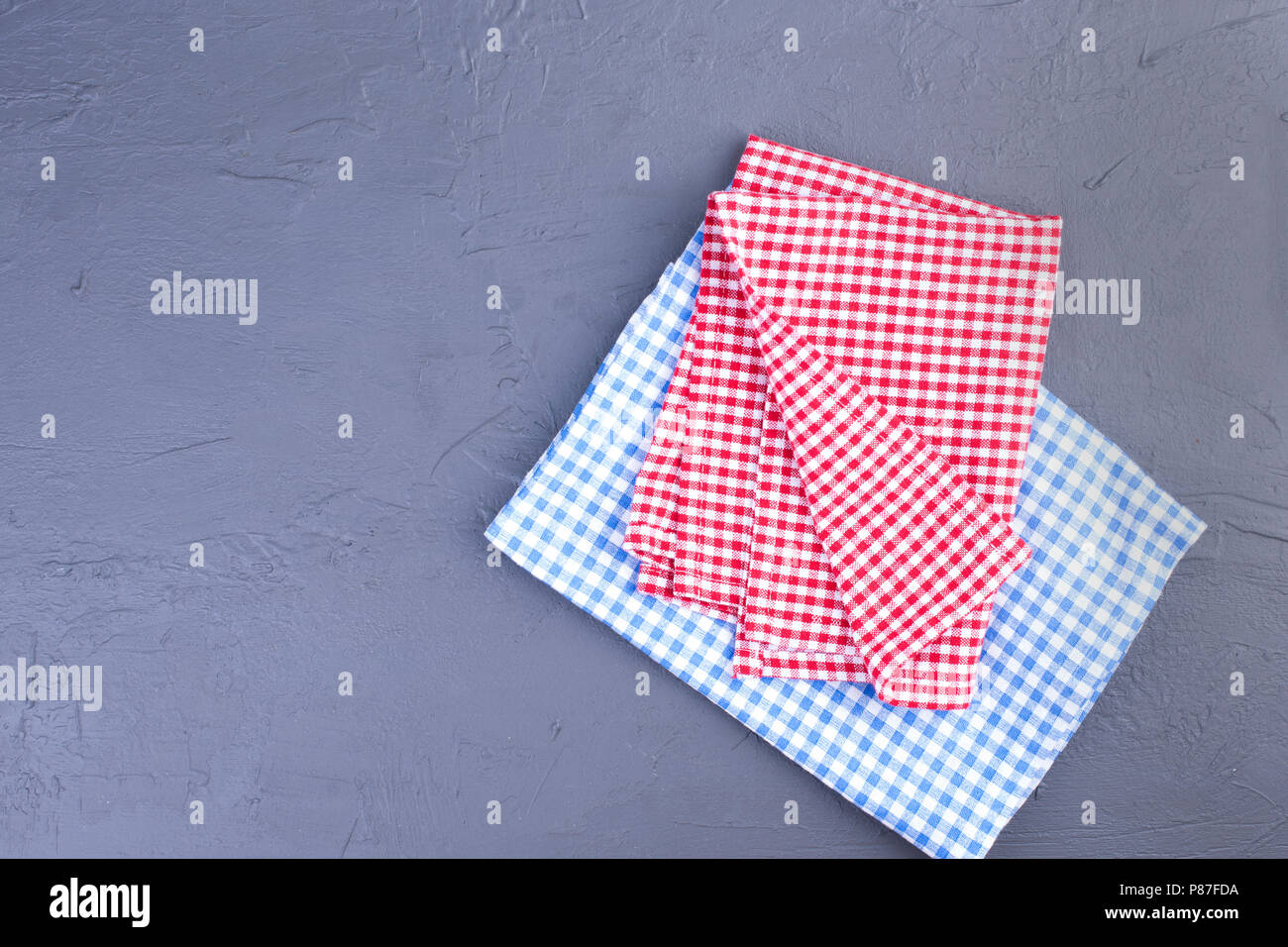 on the table, in a red and blue cage. Clean table. Copy space. Stock Photo