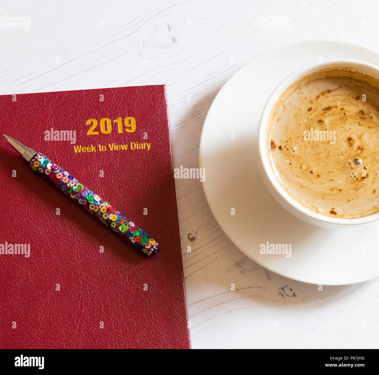 A 2019 desk dairy with a cup of coffee alongside. Stock Photo