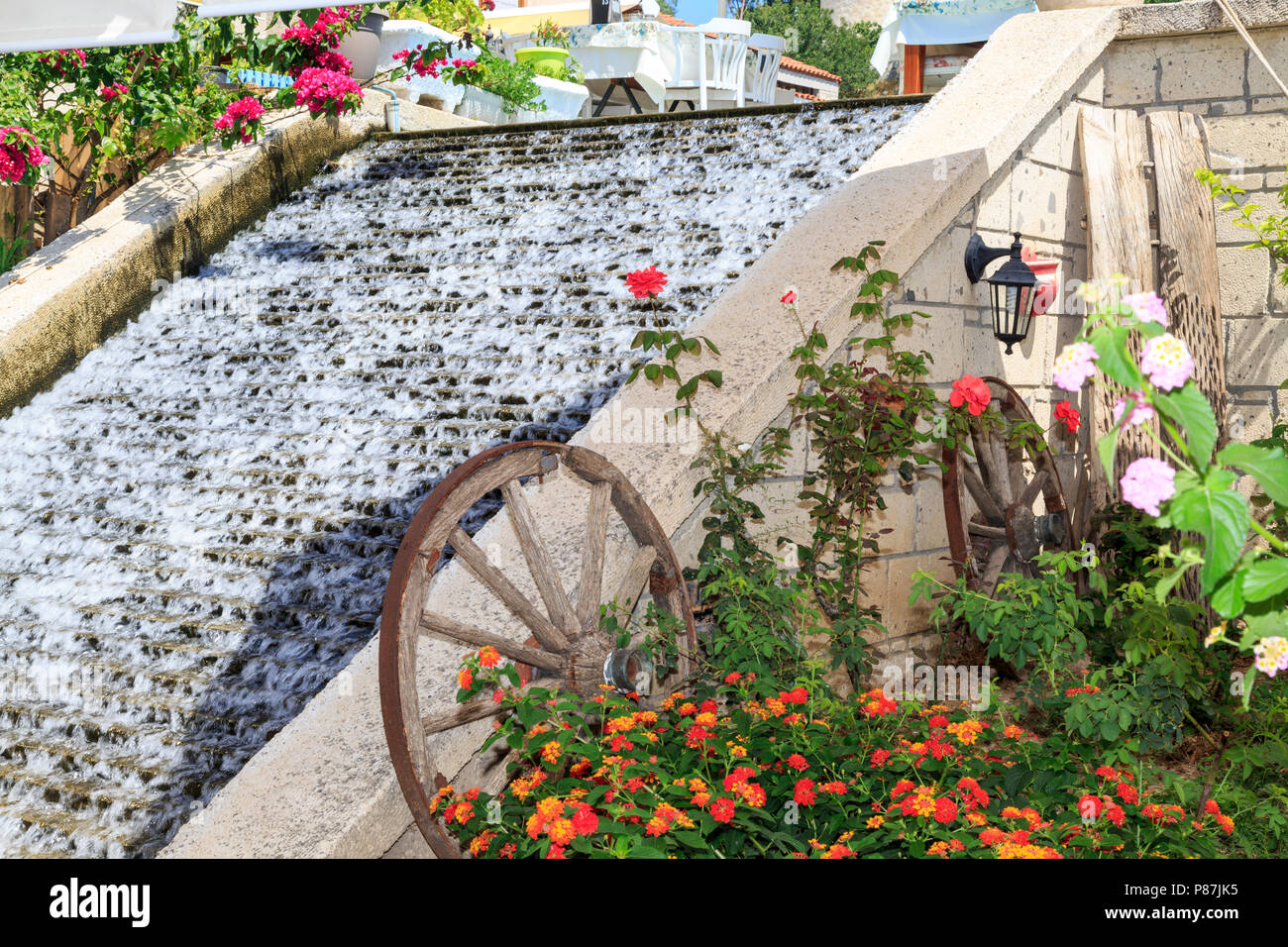 Vintage bicyle and waterfall in Alacati, Cesme, Izmir, Turkey Stock Photo