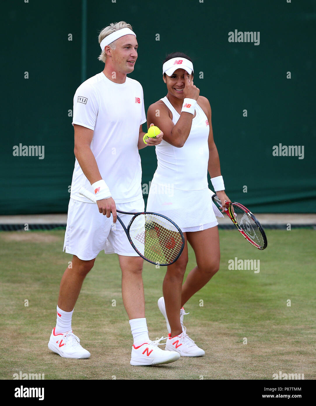 Henri Kontinen and Heather Watson during the doubles on day seven of the  Wimbledon Championships at the All England Lawn Tennis and Croquet Club,  Wimbledon Stock Photo - Alamy