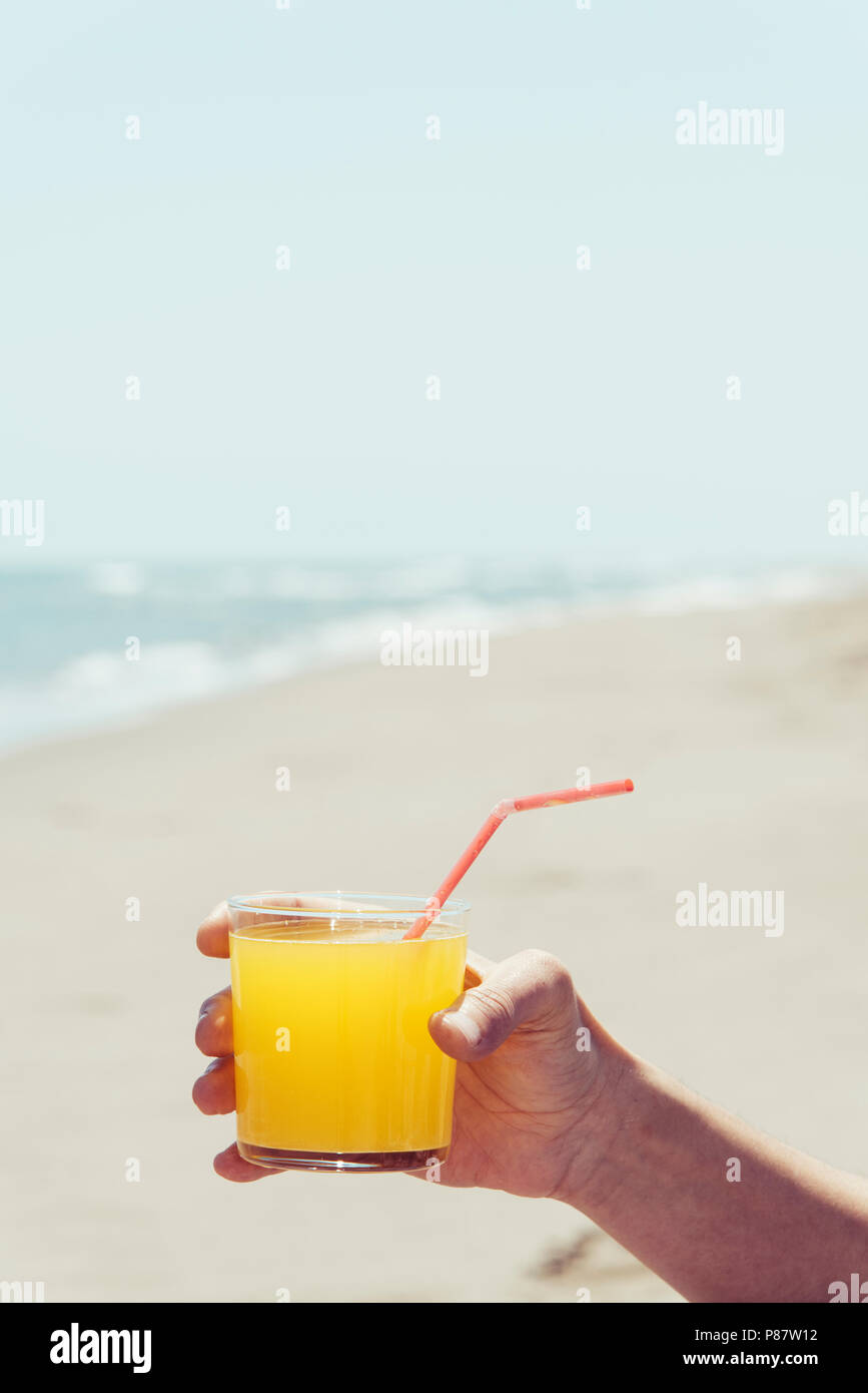 Man relaxing drink on beach hi-res stock photography and images - Alamy