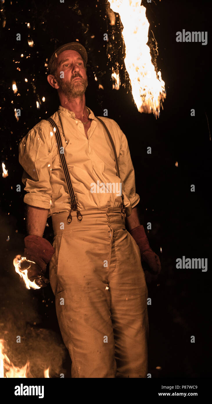 Flame thrower, Jony Easterby in his new show Tree and Wood at the Timber Festival Stock Photo