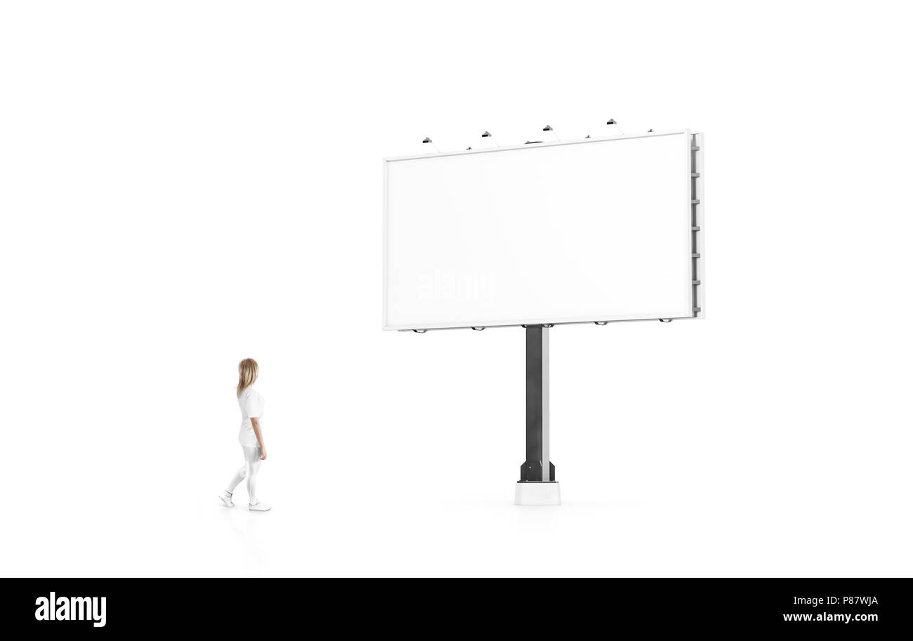 Woman stand beside blank white banner mock up on city billboard. Empty bill board mockup isolated. Clear canvas template on street sign. Large outdoor Stock Photo
