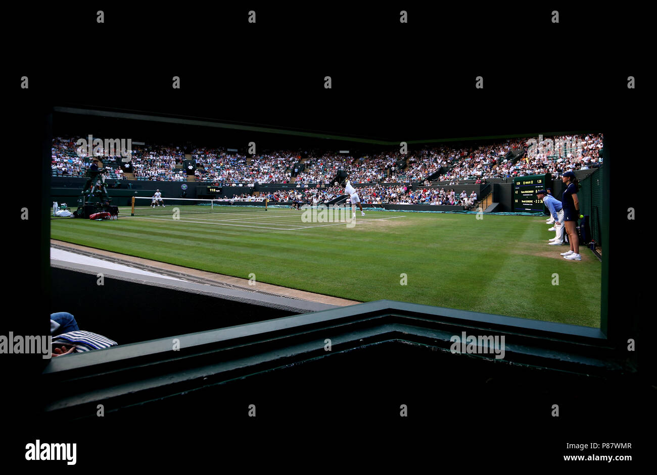 Novak Djokovic serves on day seven of the Wimbledon Championships at the All England Lawn Tennis and Croquet Club, Wimbledon. Stock Photo