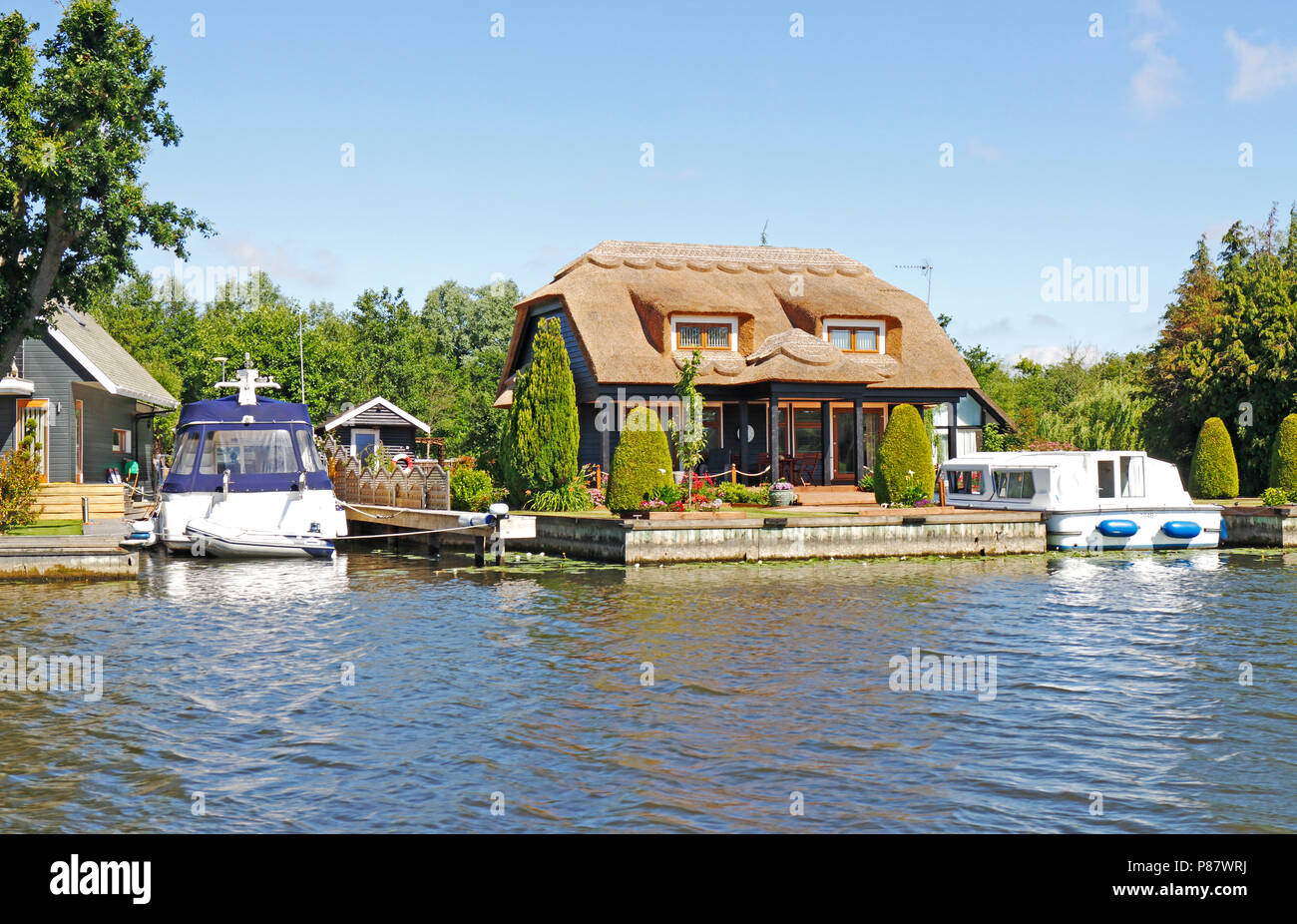 A desirable thatched riverside property by the River Bure on the Norfolk Broads at Horning