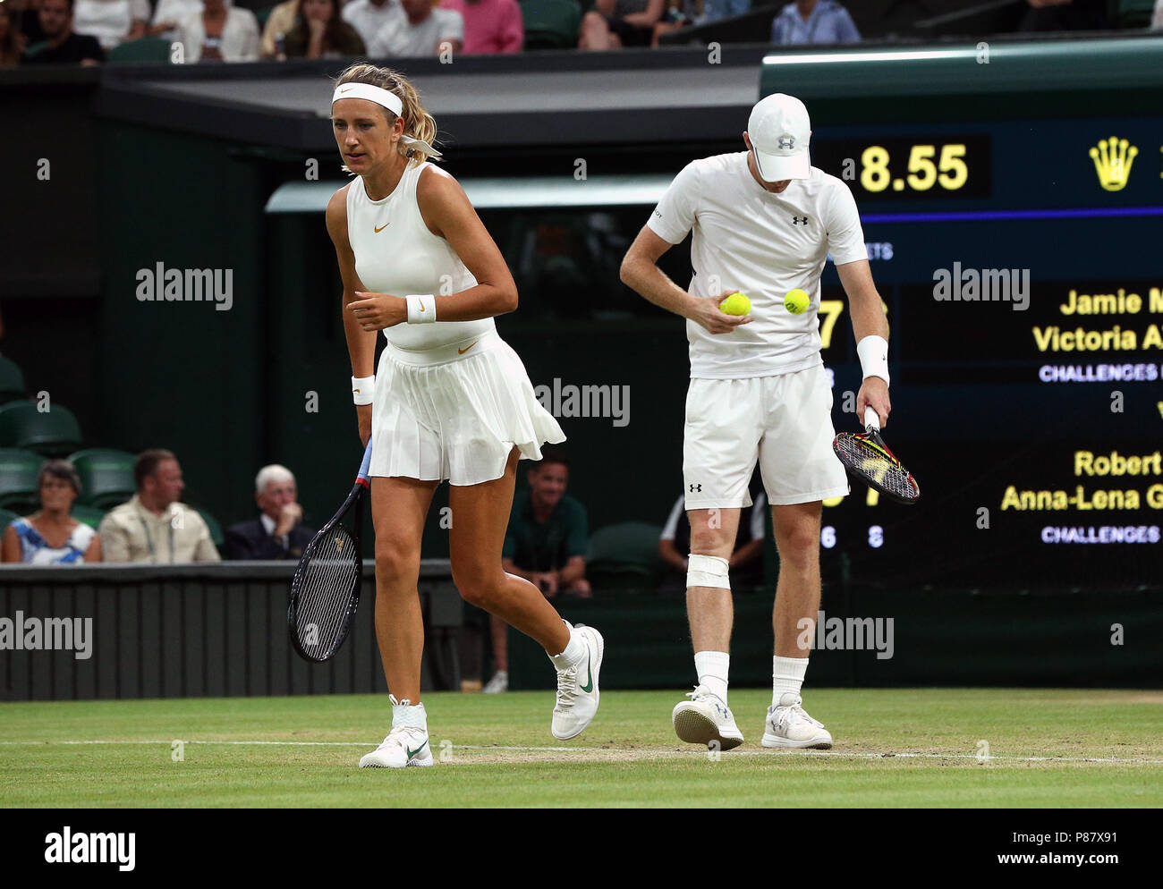 Victoria Azarenka and Jamie Murray during the doubles on day seven of the Wimbledon Championships at the All England Lawn Tennis and Croquet Club, Wimbledon. PRESS ASSOCIATION Photo. Picture date: Monday July 9, 2018. See PA story TENNIS Wimbledon. Photo credit should read: Jonathan Brady/PA Wire. Stock Photo