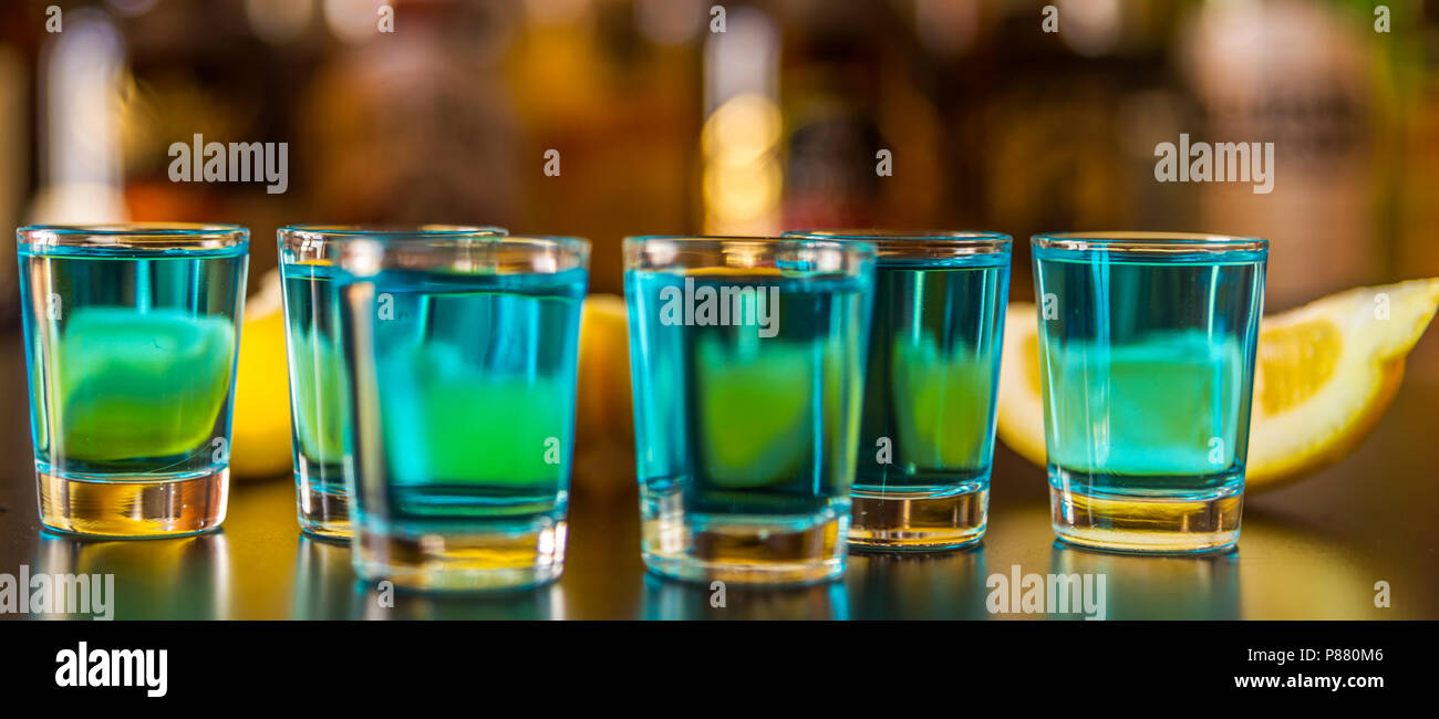 Popular blue drink shot kamikaze on the background of the bar with ...