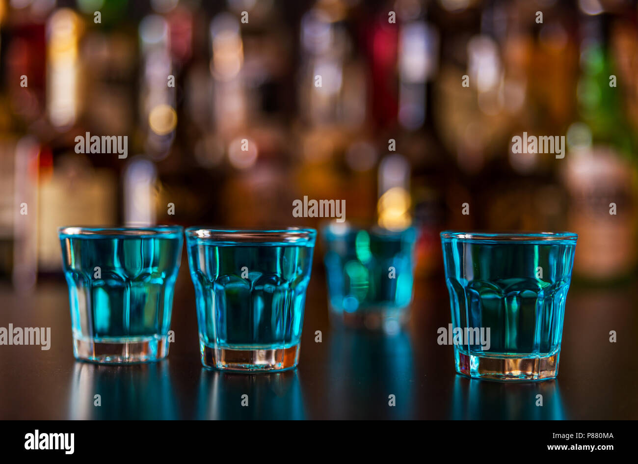Popular blue drink shot kamikaze on the background of the bar with ...