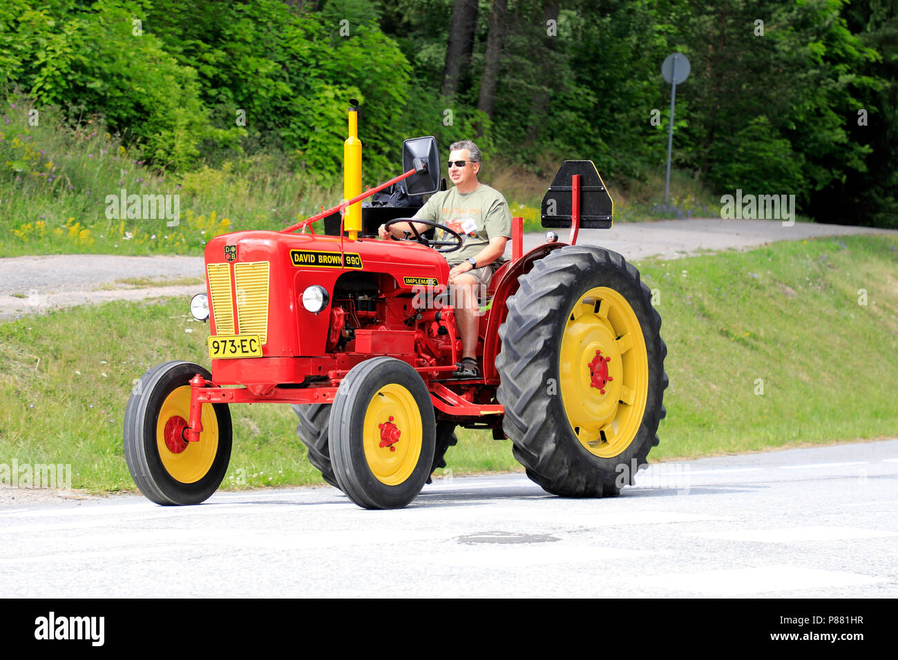 Classic David Brown 990 tractor and driver on Kimito Tractorkavalkad, Tractor Cavalcade, an annual tractor show in Kimito, Finland - July 7, 2018. Stock Photo