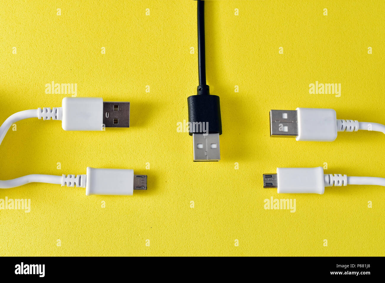 usb cables to transmit data on yellow background Stock Photo