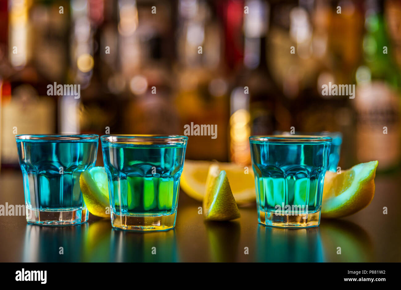 Popular blue drink shot kamikaze on the background of the bar with ...