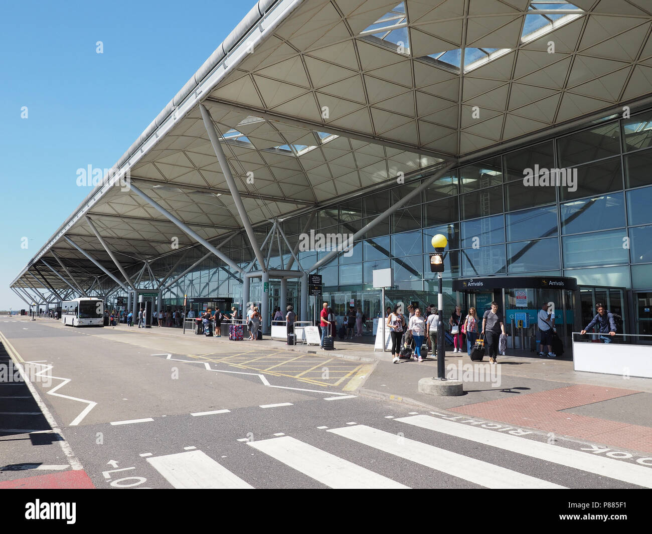 STANSTED, UK - CIRCA JUNE 2018: Travellers at London Stansted airport design by architect Lord Norman Foster Stock Photo