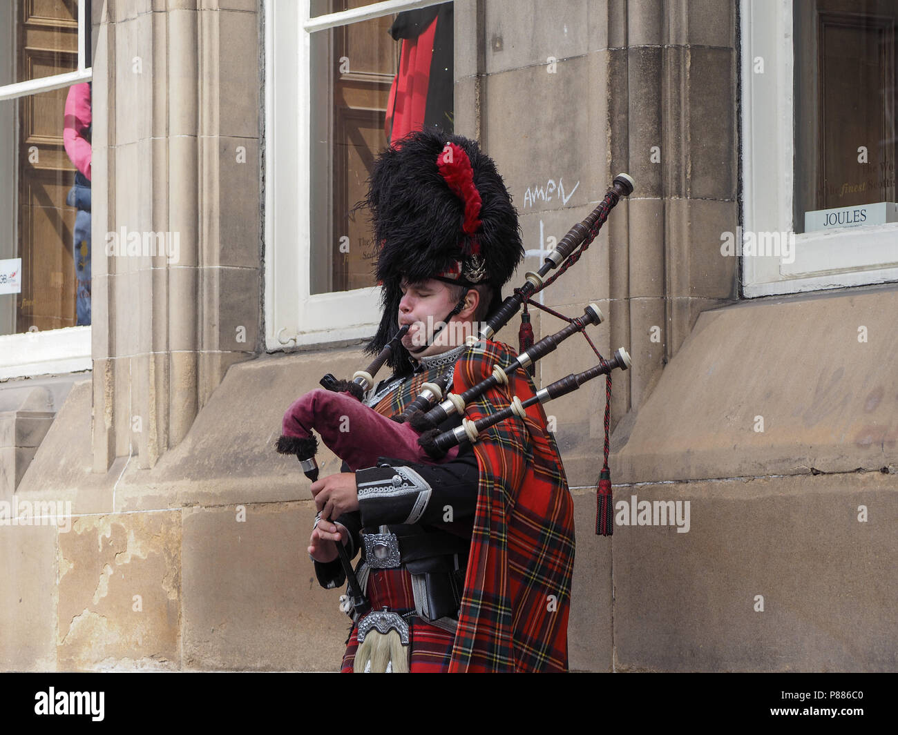 black bagpipe player image black bagpipe player image