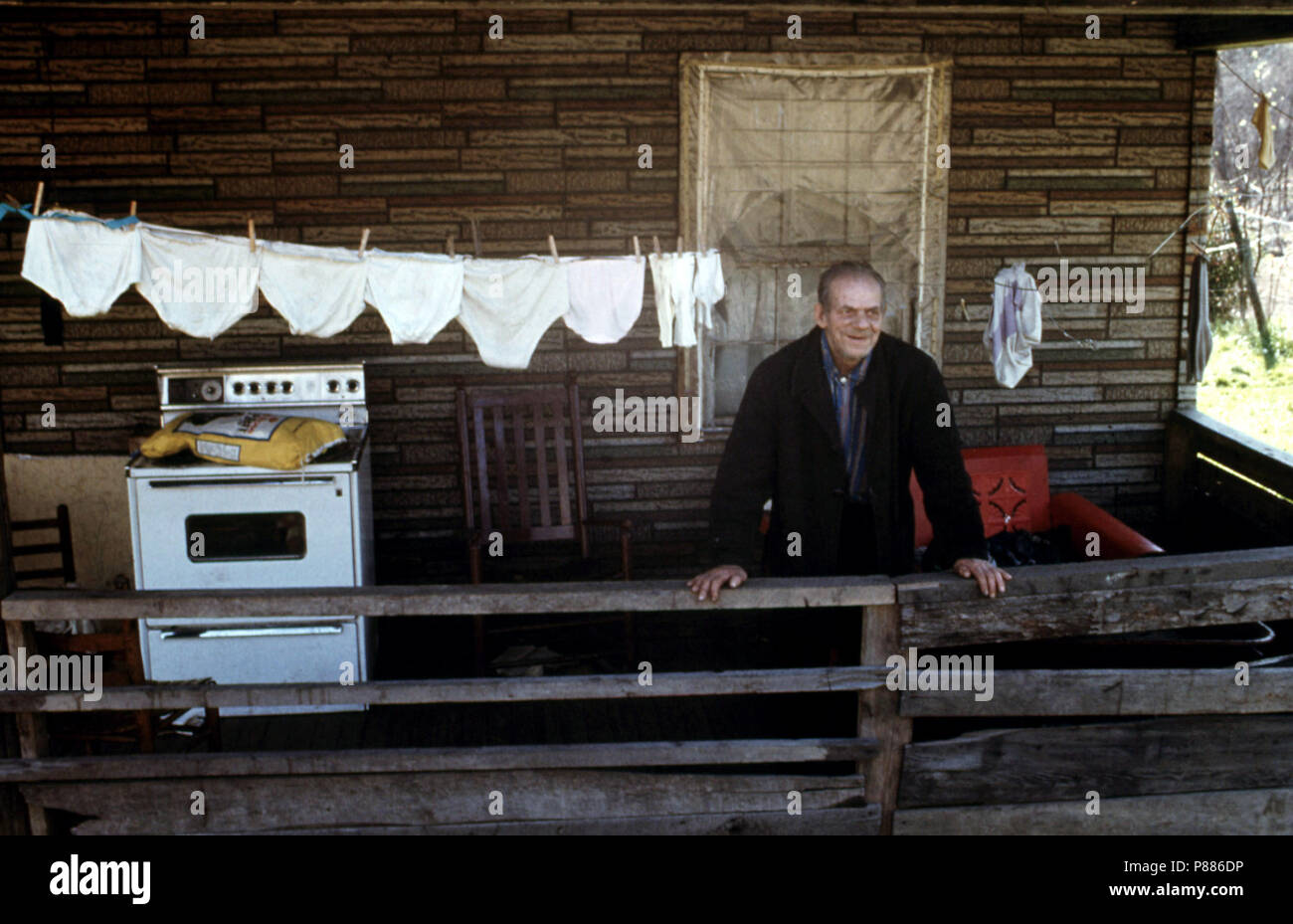 Hiram Lilly, 84, Stands on the Porch of His Daughter's Home in Fireco