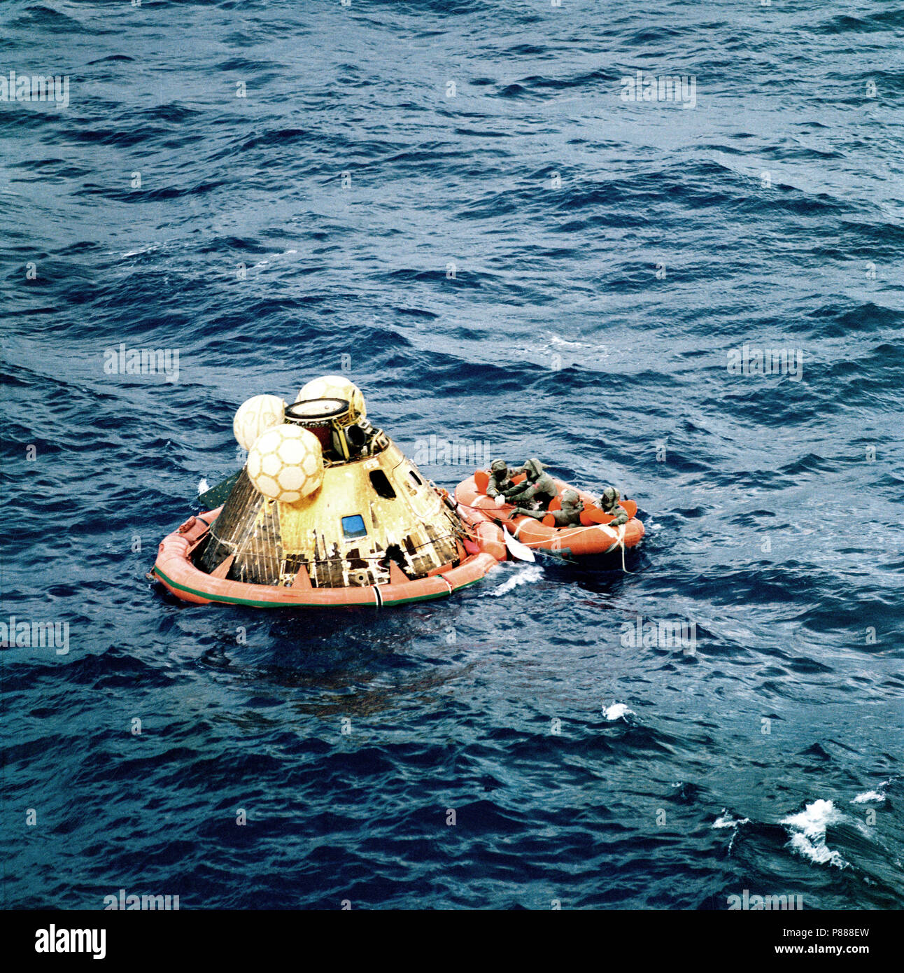 The three Apollo 11 crew men await pickup by a helicopter from the USS Hornet, prime recovery ship for the historic Apollo 11 lunar landing mission Stock Photo