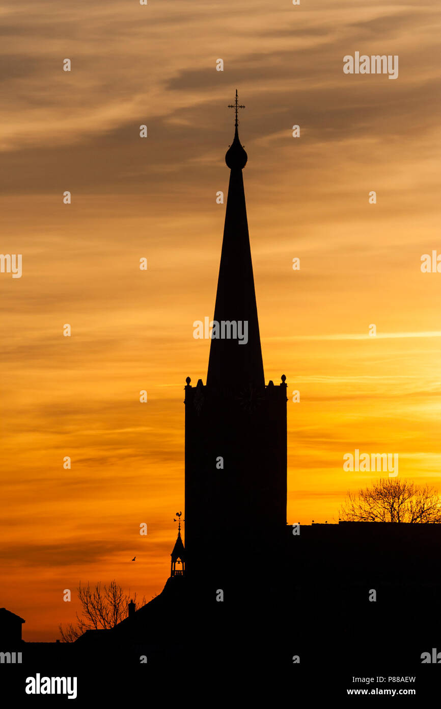 Silhouette of church at Stompwijk at sunset Stock Photo