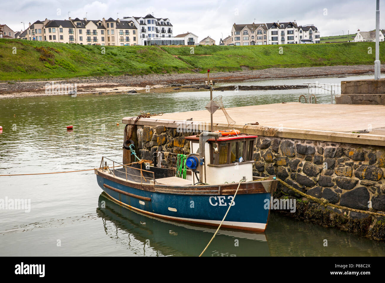 UK, Northern Ireland, Co Antrim, Portballintrae, fishing boat moored in the harbour Stock Photo