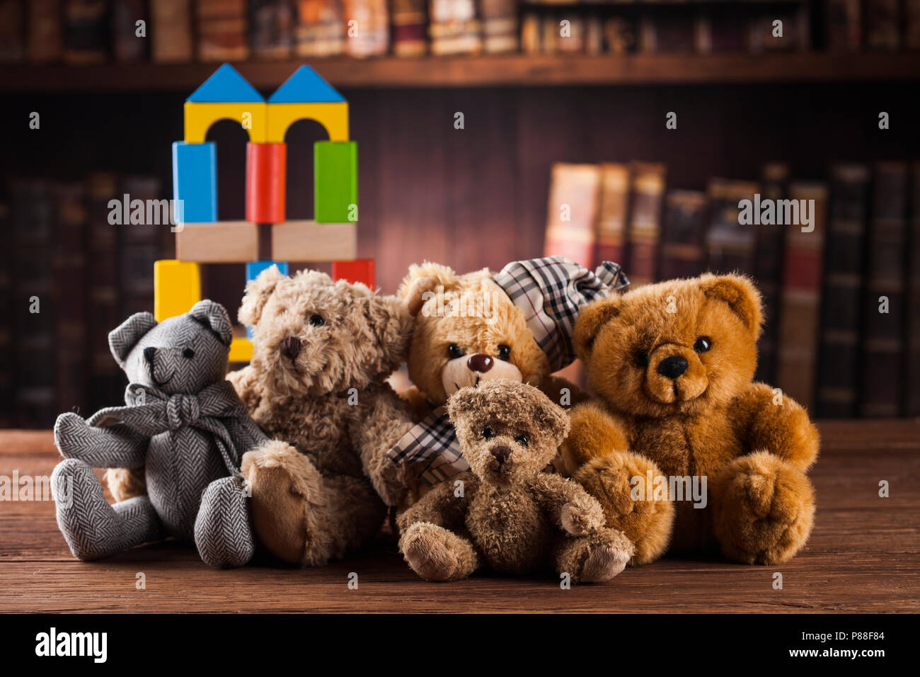 Cute teddy bears with old vintage wood background Stock Photo - Alamy