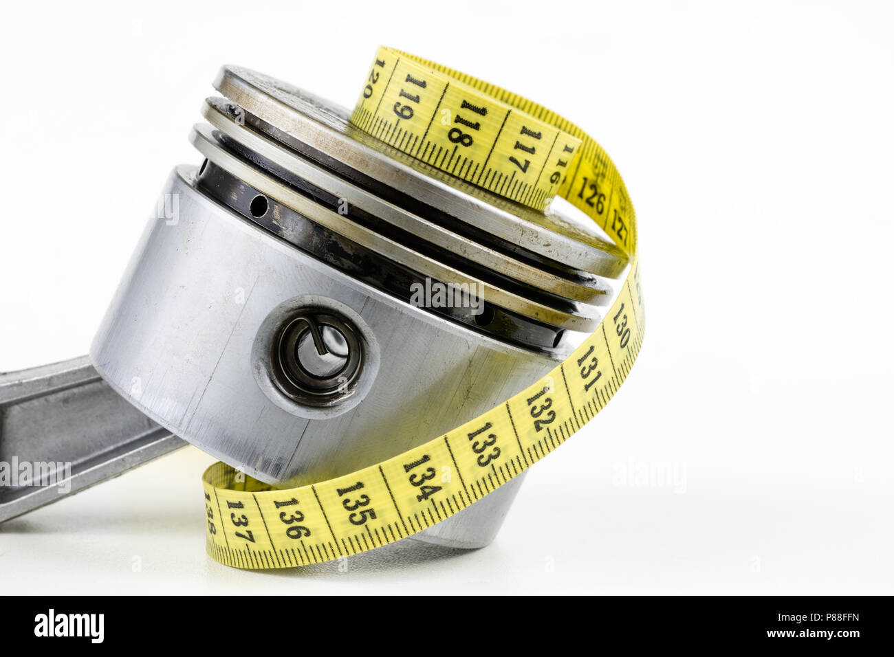 A piston from an internal combustion engine and a tailor measure on a