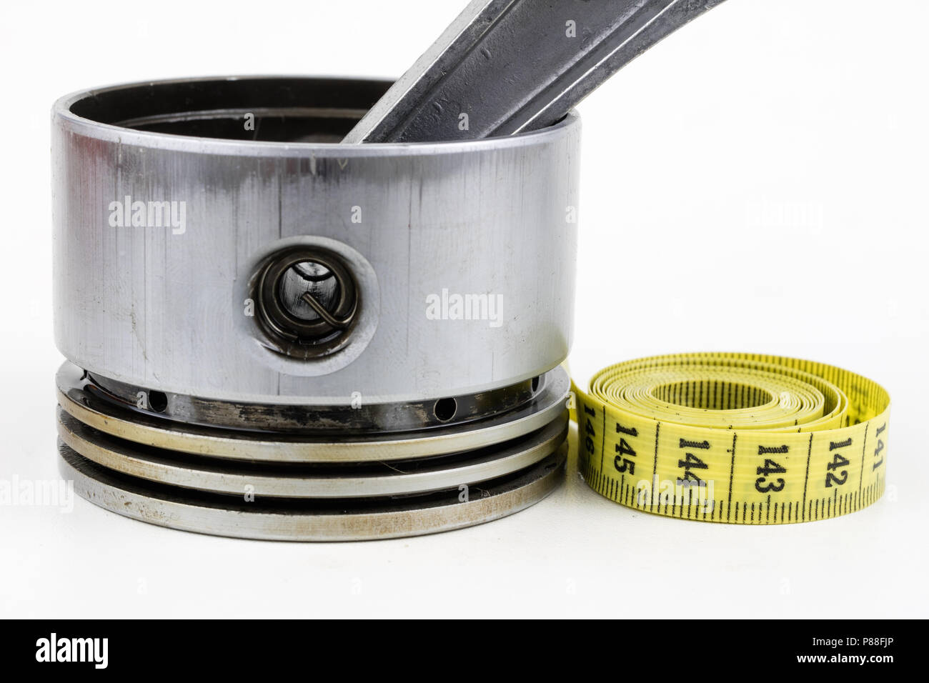 A piston from an internal combustion engine and a tailor measure on a