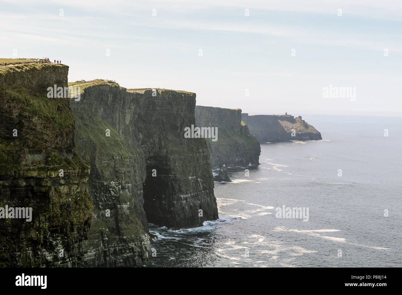 The Cliffs of Moher are soaring sea cliffs located at the southwestern edge of the Burren region in County Clare, Ireland. Stock Photo