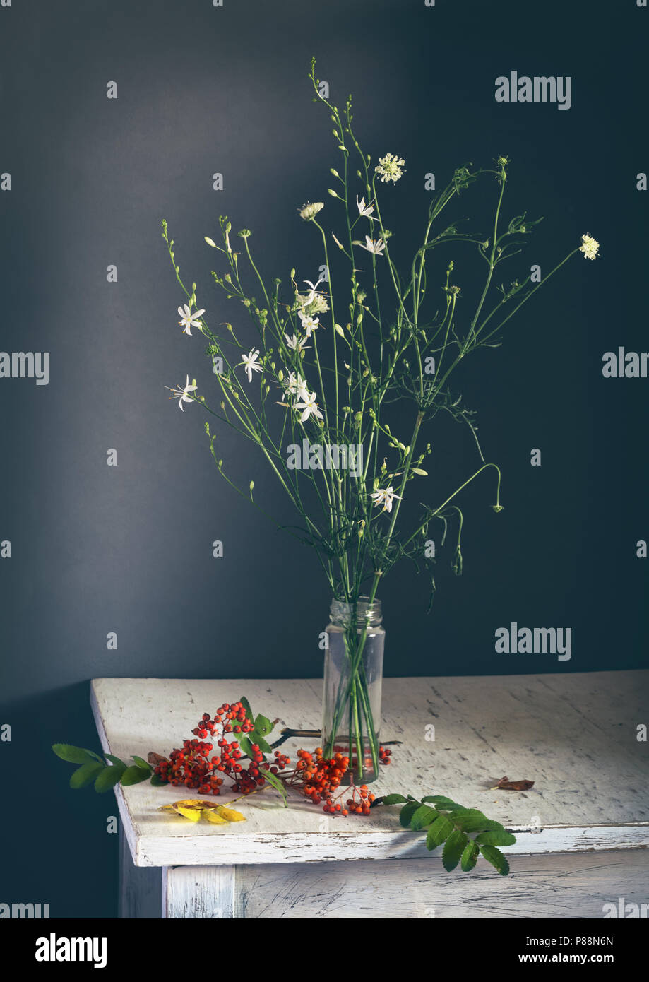 still life with wildflowers and rowan. vintage. bouquet. berries. Stock Photo