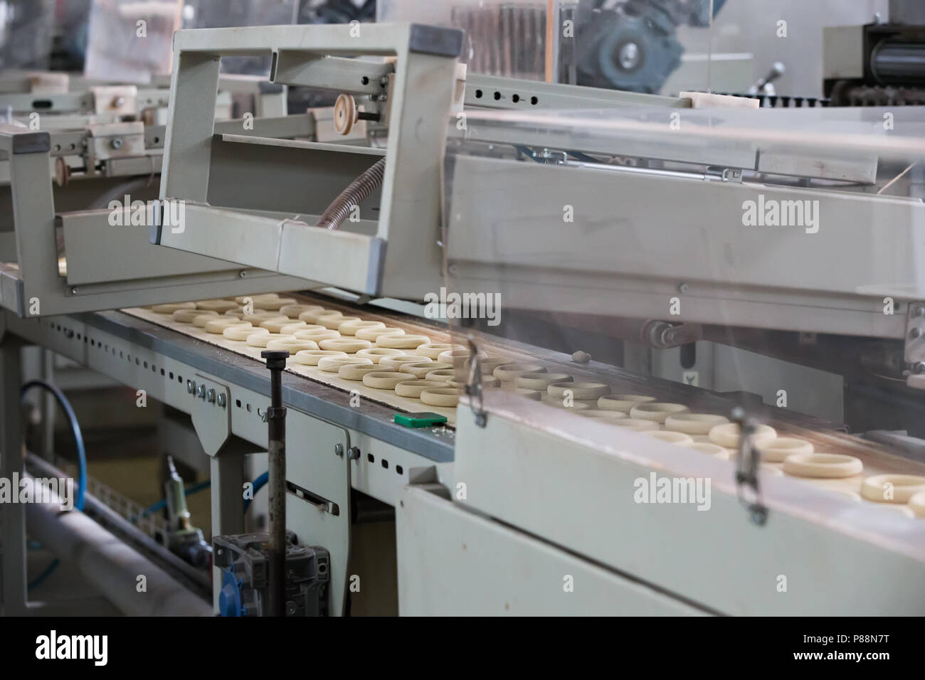 https://c8.alamy.com/comp/P88N7T/industrial-line-for-the-production-of-biscuits-and-bagelsthe-furnace-for-automatic-heating-of-cookies-P88N7T.jpg
