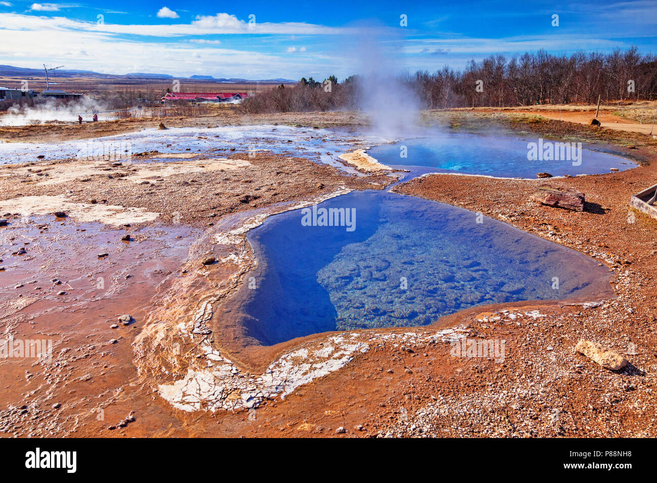 20 April 2018: Geysir, Iceland - Hot springs steaming on a fine spring day. Stock Photo