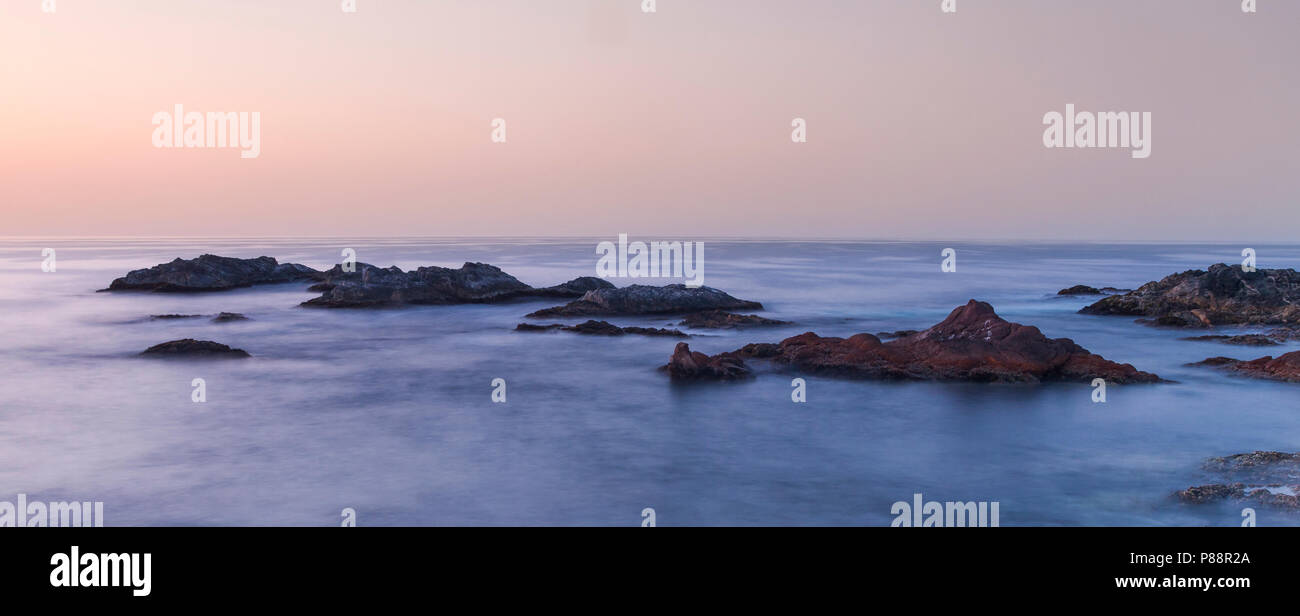 Rocky coast at Mirbat, Oman Stock Photo