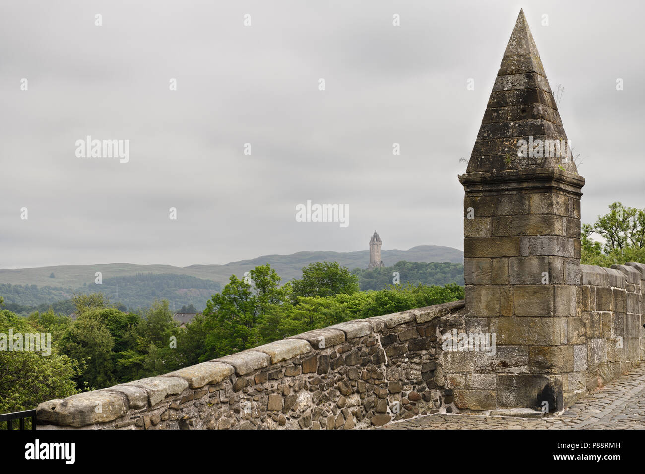 National Wallace Monument crown spire from the Old Stirling Bridge with clouds Stirling Scotland UK Stock Photo