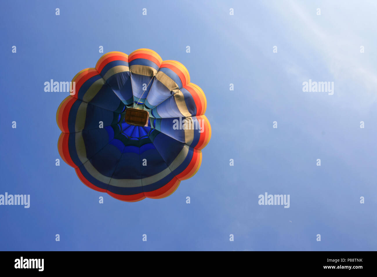 Colorful hot air balloon with blue sky background Stock Photo - Alamy