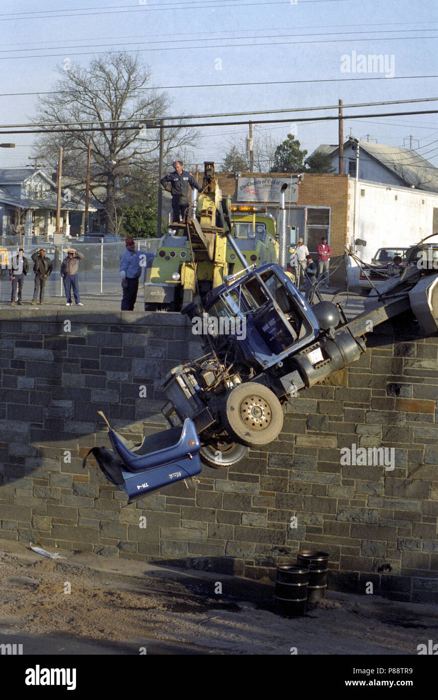 tractor trailer hangs off a bridge in Chapel Oaks, Maryland Stock Photo