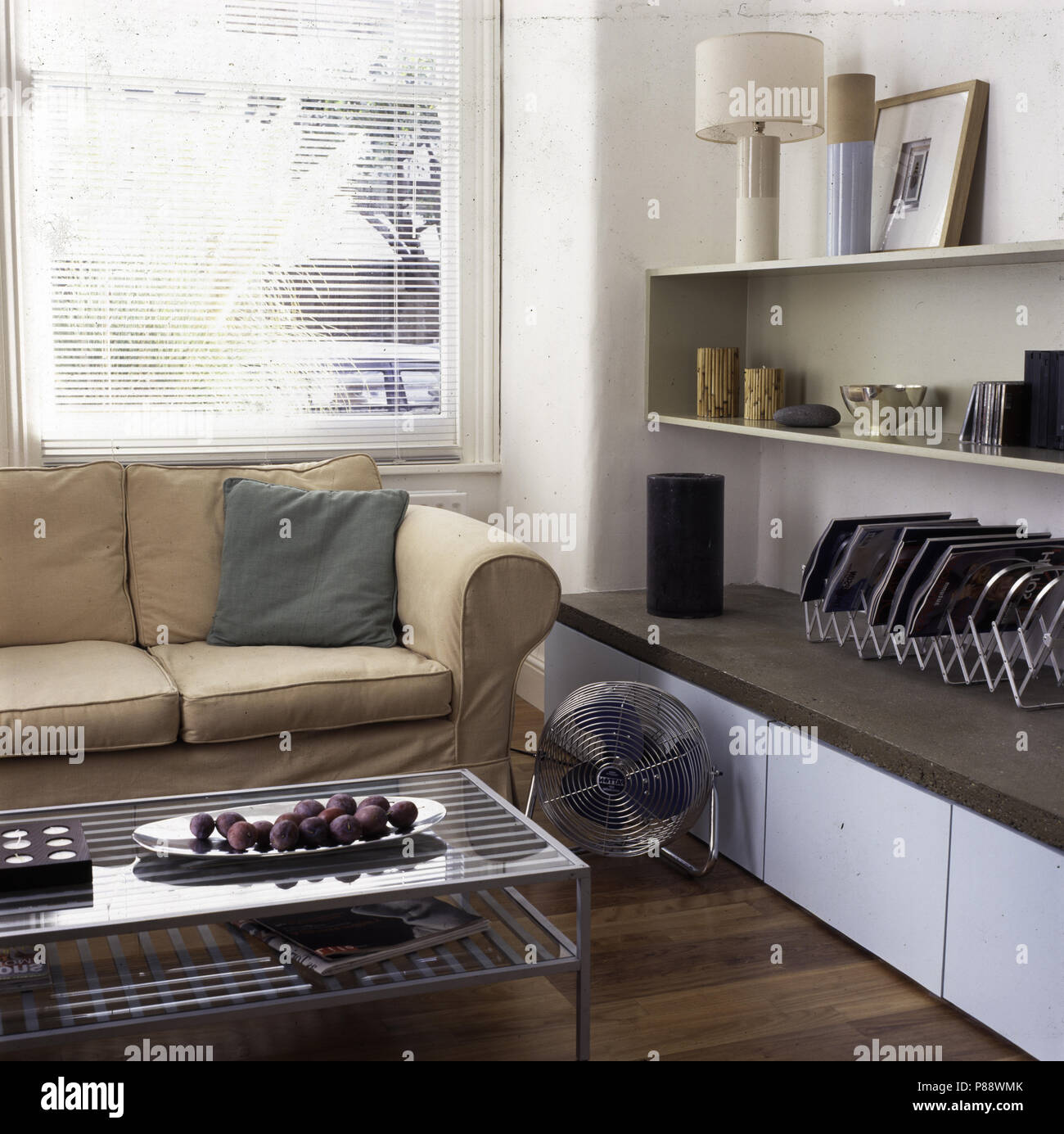 Modern living room with glass topped coffee table Stock Photo - Alamy