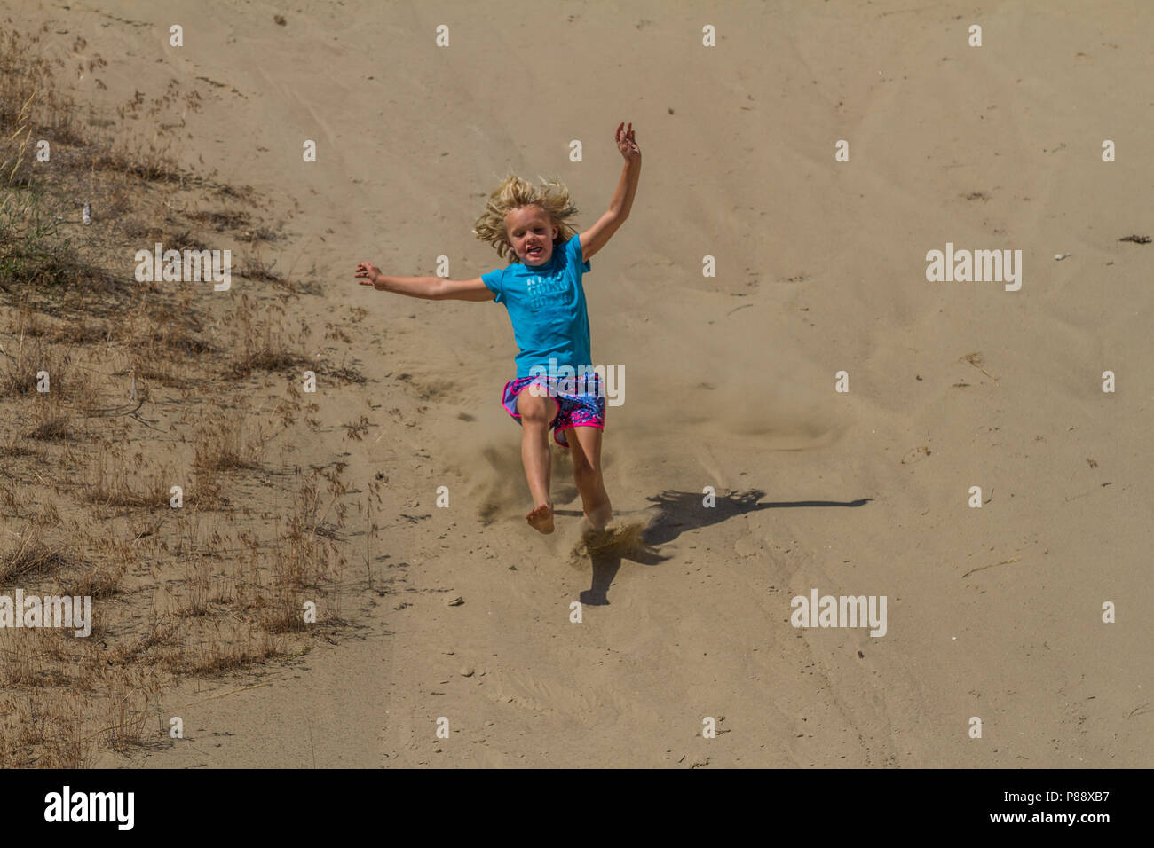 Child running down hill hi-res stock photography and images - Alamy