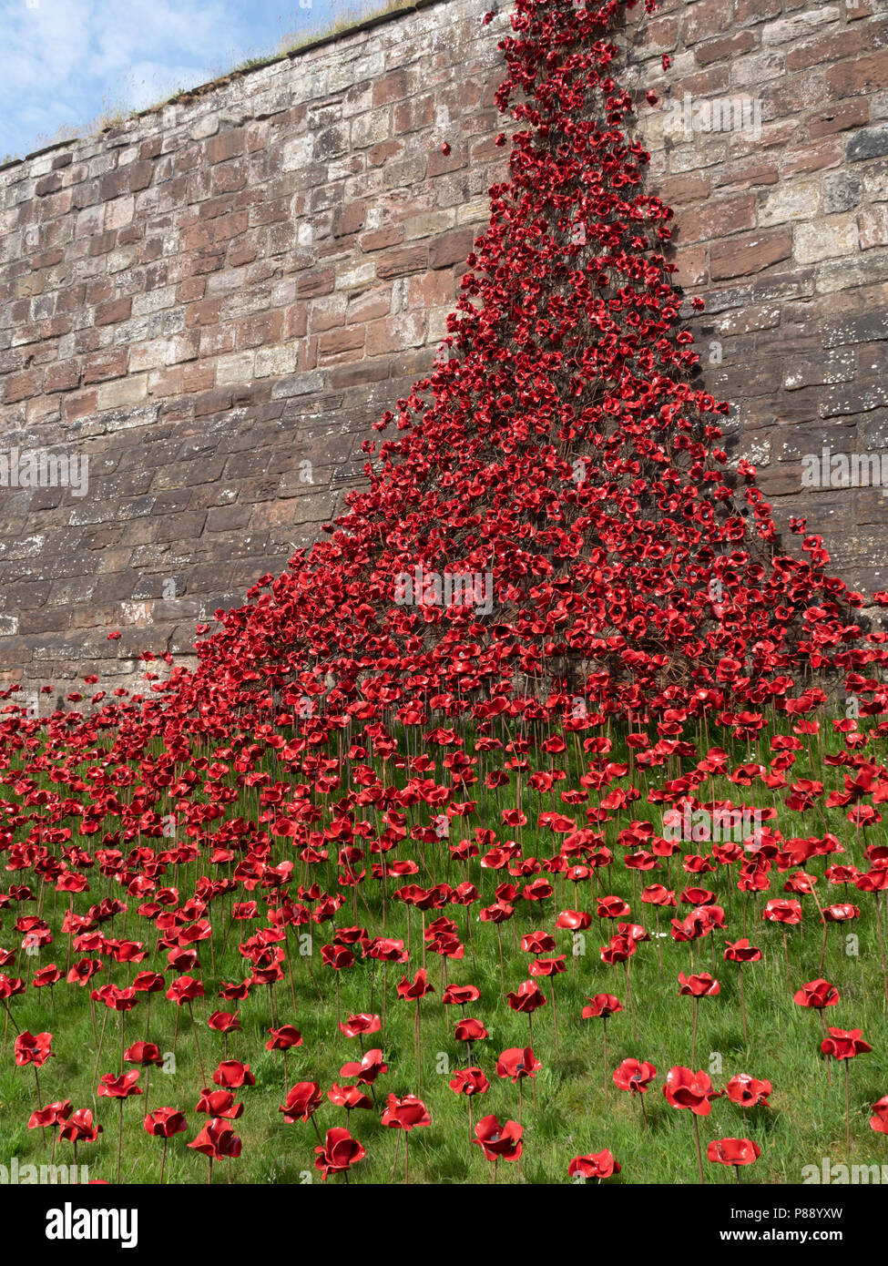 Carlisle Castle, Cumbria, UK:Weeping Window commemorative art installation, 100 years since WW1. 888,246 ceramic art poppies mark the number of lives  Stock Photo