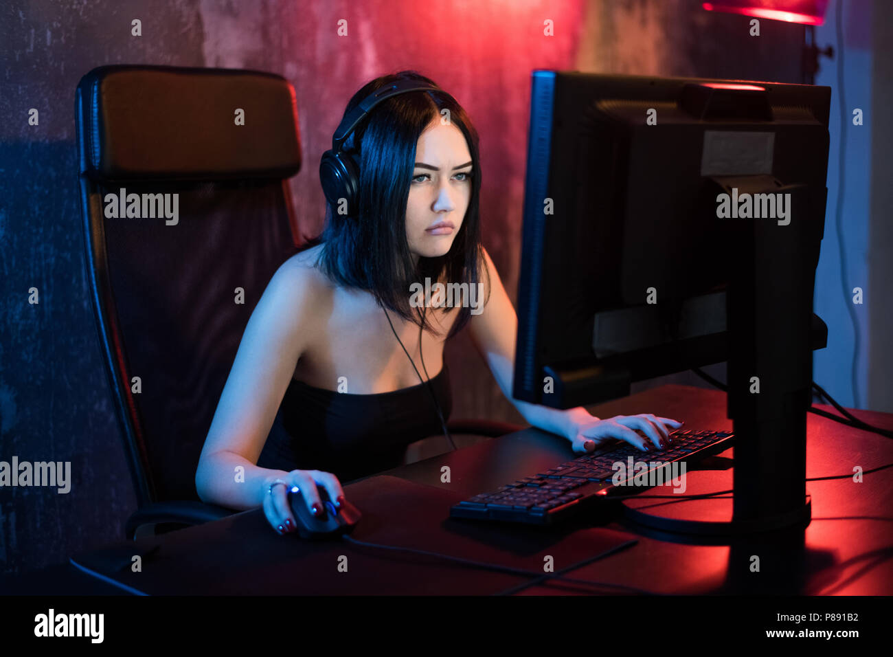 Young Girl Playing Game Computer Online In Internet Cafe Stock Photo,  Picture and Royalty Free Image. Image 101617114.