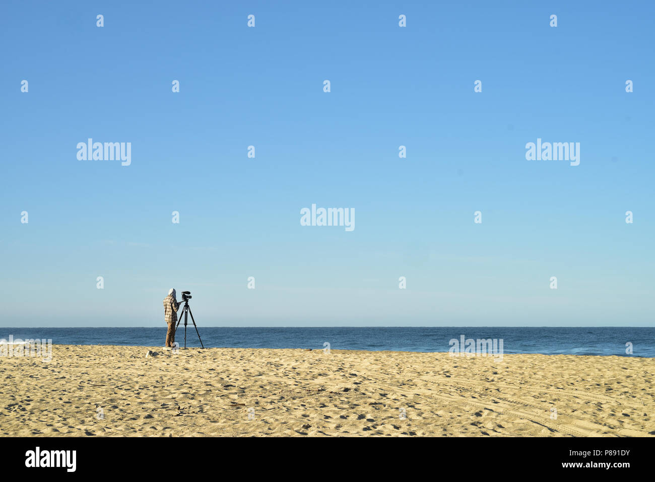 Operator stands camera on tripod hi-res stock photography and images ...