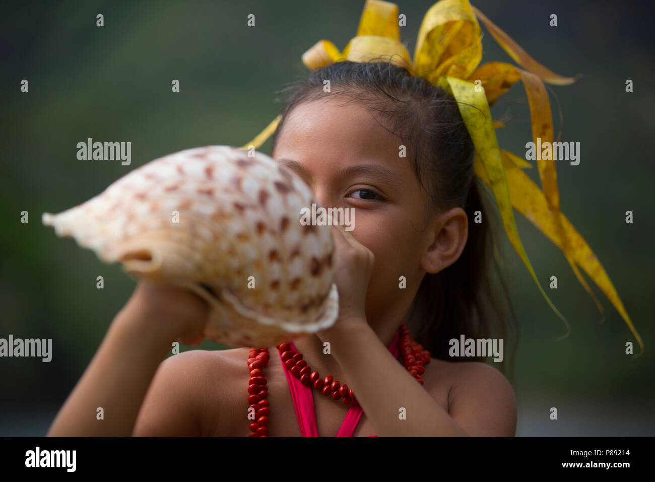 Young Girl Playing A Conch Shell Stock Photo Alamy