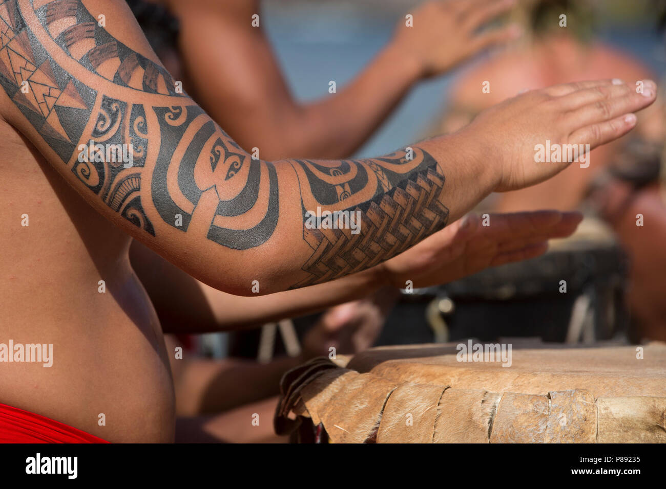 Tattoo on Drummer's Arm, Marquesas Islands Stock Photo