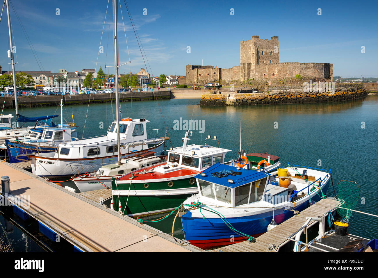 UK, Northern Ireland, Co Antrim, Carrickfergus, Norman Castle from across the harbour at high tide Stock Photo