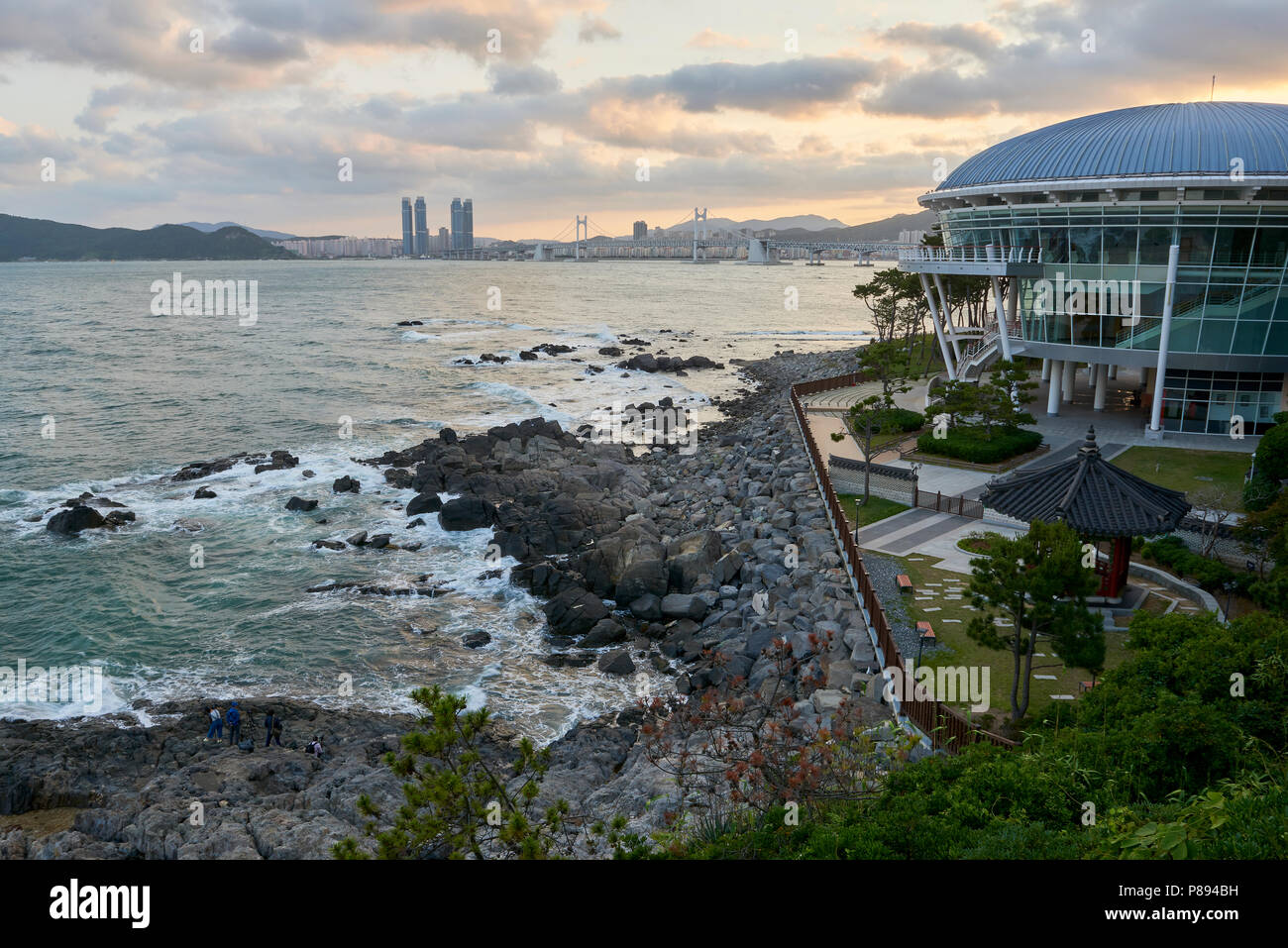 Seascape in Busan, South Korea, with APEC building in the foreground and city in the far horizon. Stock Photo