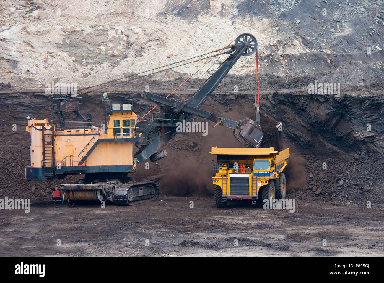 big mining truck unload coal Stock Photo - Alamy